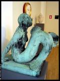 The other mermaid, sitting inside a museum