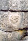 Beautiful human face carved in a corner stone