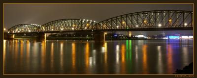 Bridge over a colorful Danube by bracket