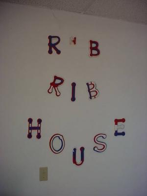 R & B Rib House next to Bill's barber shop. Delicious food !!