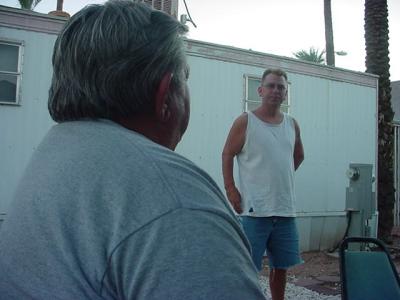 Rick talking to Jeffrey Louis about a slide carrousel projector