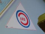 reflection of the Cubs banner at Bills barber shop