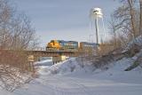 Engines take freight section across Store Creek bridge before hooking up to passenger section