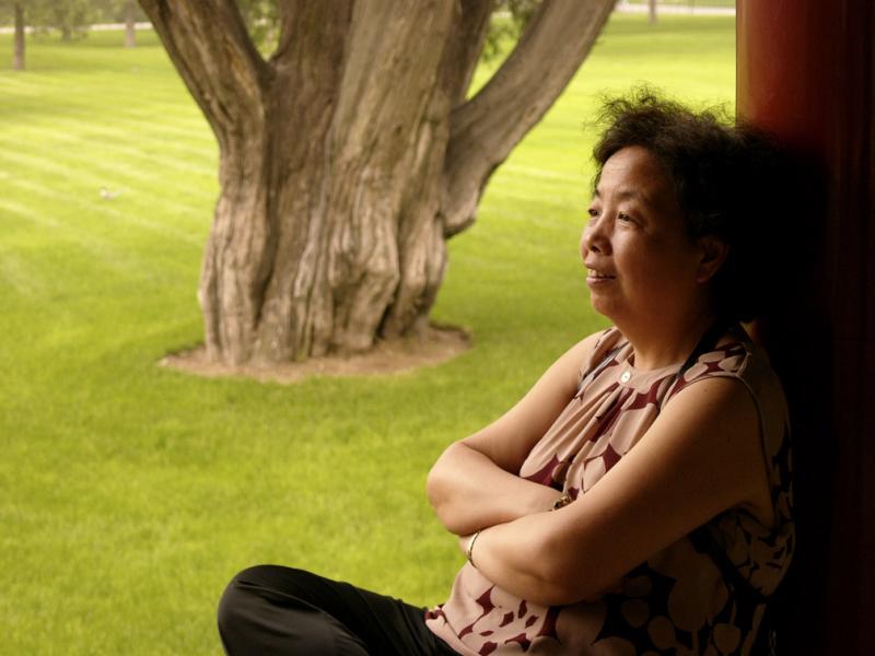 Woman at rest, Temple of Heaven, Beijing, China, 2004