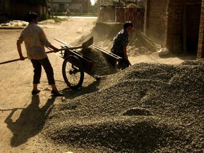 Shoveling gravel outside of Xian, China, 2004