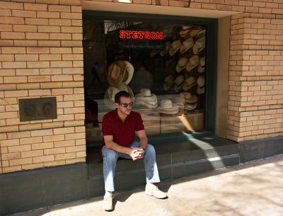 Darren Sitting Outside Hat Store