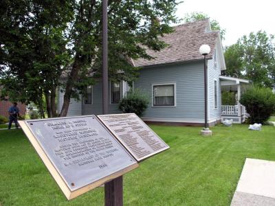 The Russell House and historic landmark plaque.