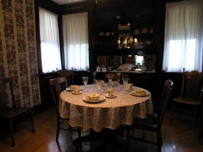 Inside the Russell house, the dining room has been furnished with period pieces in keeping with the time.