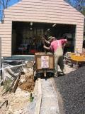 emptying the truck behind retaining wall
