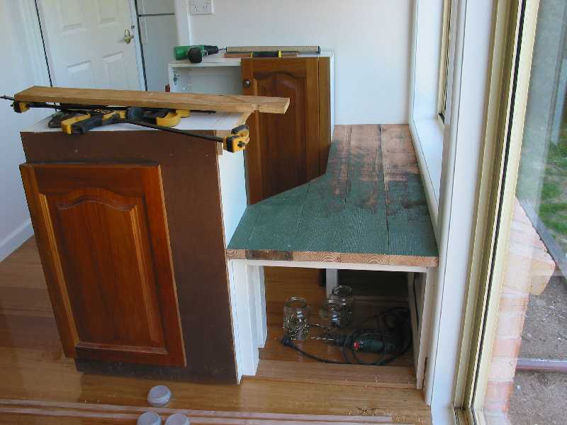 bar seat is recycled from oregon carport beams