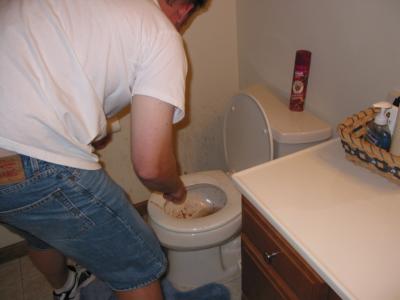 Ted trying to clean up his second mess.  Note the stuff on the walls