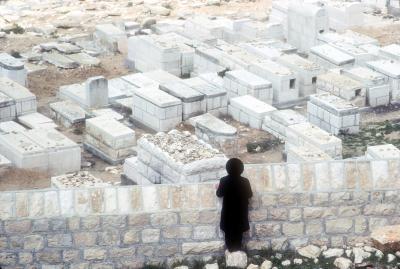 Rabbi Throwing Stones at Graves of Loved Ones as a Sign of Respect