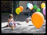 Girl playing on the sidewalk