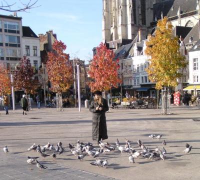I'm feeding the pigeons in the Square.