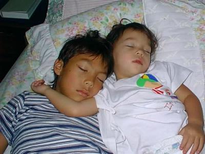 Brother and sister asleep