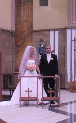 Maria and Ronnie at the altar.jpg