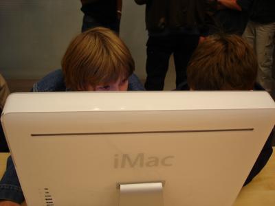 Lucas and Nathaniel check out Garage Band and an iMac.