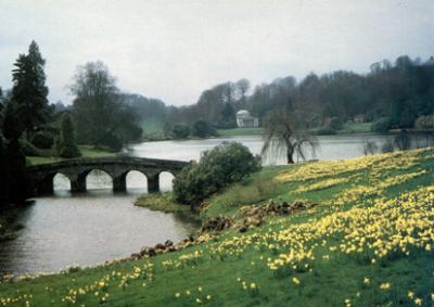 Stourhead Garden: The buildings and bridges have an Italian influence. A Pantheon style building is in the background.
