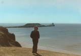 Wales: Richard at Rhossili Bay with the Worms Head rocks behind him