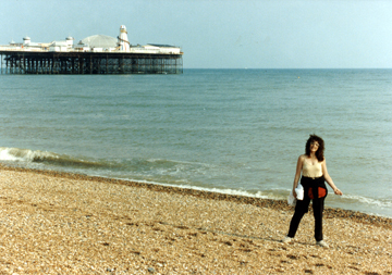 Judy on the beach in Brighton. The water is on the cool side. The Palace Pier is in the background.