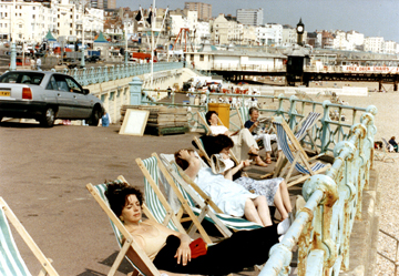 Judy took immediate advantage of the sun on Brighton's boardwalk.
