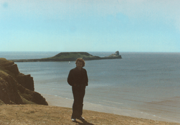 Wales: Richard at Rhossili Bay with the Worm's Head rocks behind him