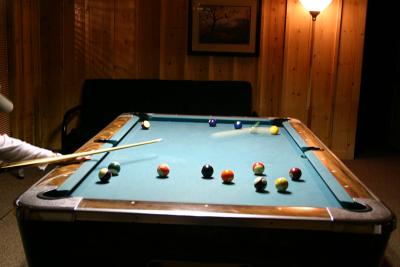 Kim shooting pool.