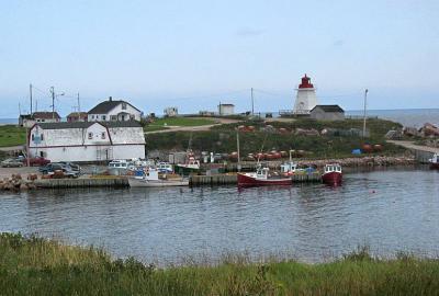 Small fishing village of Neils Harbour.  According to Industry Canada, the population count is 493 with 212 dwellings.