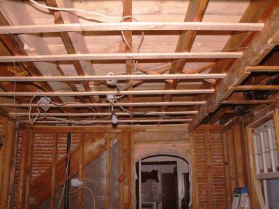 Kitchen ceiling.  Note the new sub-flooring for the bathroom upstairs and added structural beam supports.