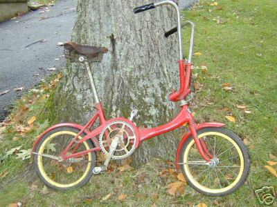 Obviously Porta-Silk's first cousin, this Shimura-Seiki Road Puppy features the same type frame, handlebars, crank, folding pedal and latch mechanism but lacks some features...Single speed hub with coaster brake, non-spring-loaded handlebars. Road Puppys mount 16 rims & tires.