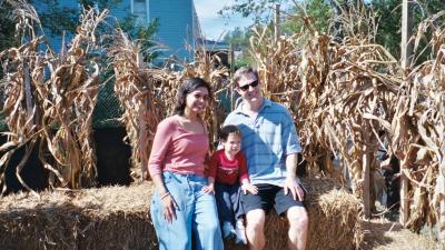 Mama, Ben, and Papa in front of the corn maze (Norfolk, VA)