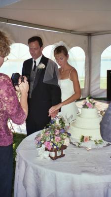 Bob and Karen as they prepare to cut their wedding cake (Sharps, VA)