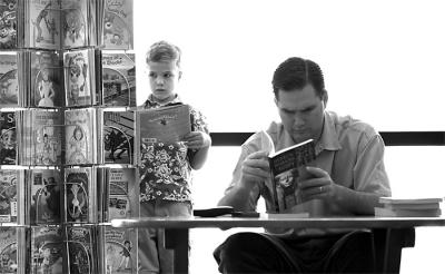 A Lost Opportunity II
As parents, we have endless opportunities to interact with and shape our children into who they will be as adults. I like this shot, as it represents a lost chance for interaction that can rever be regained.
(Disclaimer... I do not know this family, but they did have a great time together. This photo does not represent their relationship from what I could see! My comments above represent what I see in this image, not what I saw of their time together at the book store! No offense intended.)