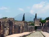 View of Vesuvius along street, fort at end