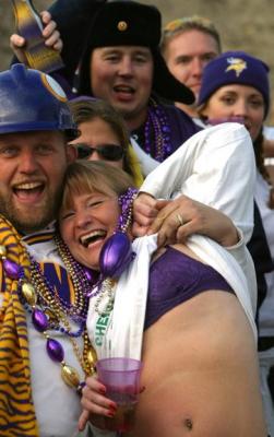 A couple at the dance party saw me with my camera and demonstrated that she is not a superficial Viking Football fan.
