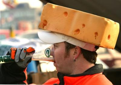A cheesehead Greenbay Packer football fan with a matching glass.