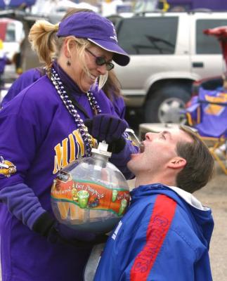 This NY Giants Football fan kicked a mini football through a goalpost and was given a shot of something for his effort.  This shows the hospitality of a Vking fan --- they will even feed a Giant.