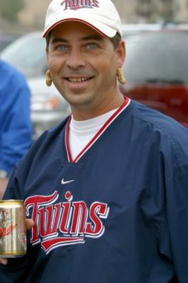 What is a Minnesota Twins baseball fan doing here?  It's ok, at least he has his pre-game nuts on -- check out those earrings.