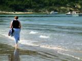 Carole walking in the shallows, Isle of Wight