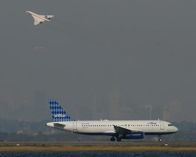 Concorde, Jetblue and NY skyline in haze.  Oct. 11, 2003