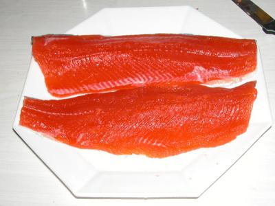 Filleted trout on white plate