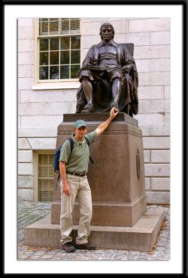 Touching the foot of John Harvard, a well worn tradition for good luck in Harvard Yard.