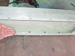 Putting the proper 6mm captive nuts in the oil cooler