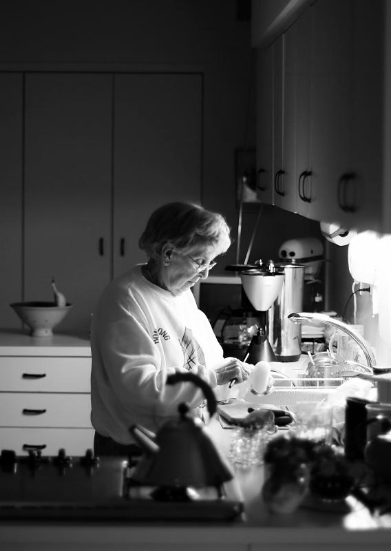 Mom peeling an onion mono