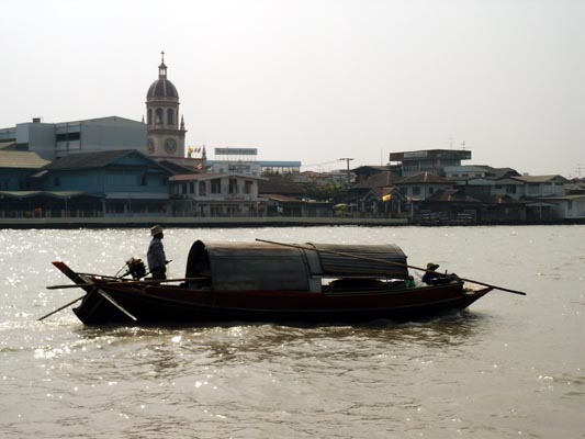 Traditional boat on the river in front of Santa Cruz Church, Bangkok