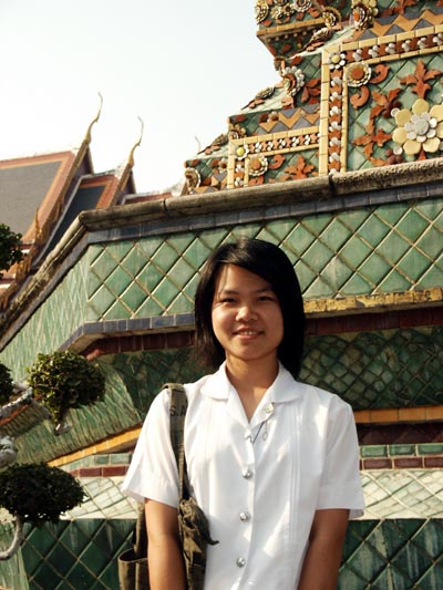 Thai college student conducting a survey at Wat Pho