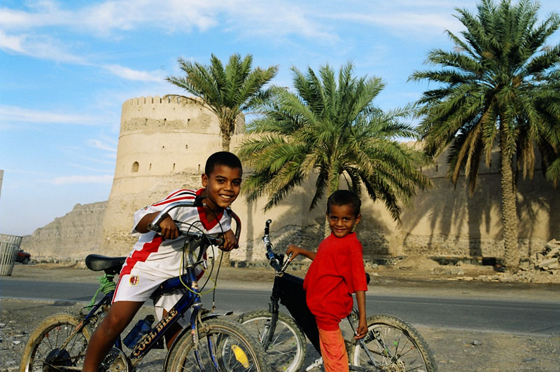 Local kids in front of Khasab Fort, Oman