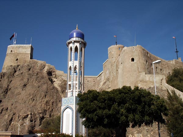 Minaret of Al Khawr Mosque with Mirani Fort, Muscat