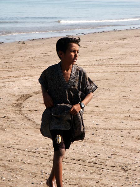 Omani boy on beach at Barka