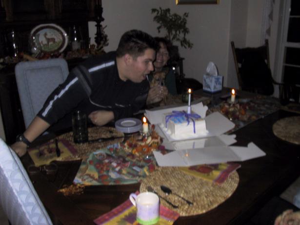 Dave blowing out candle.JPG